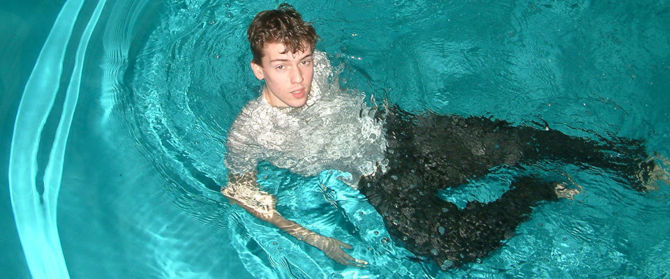 tee shirt and long pants in pool